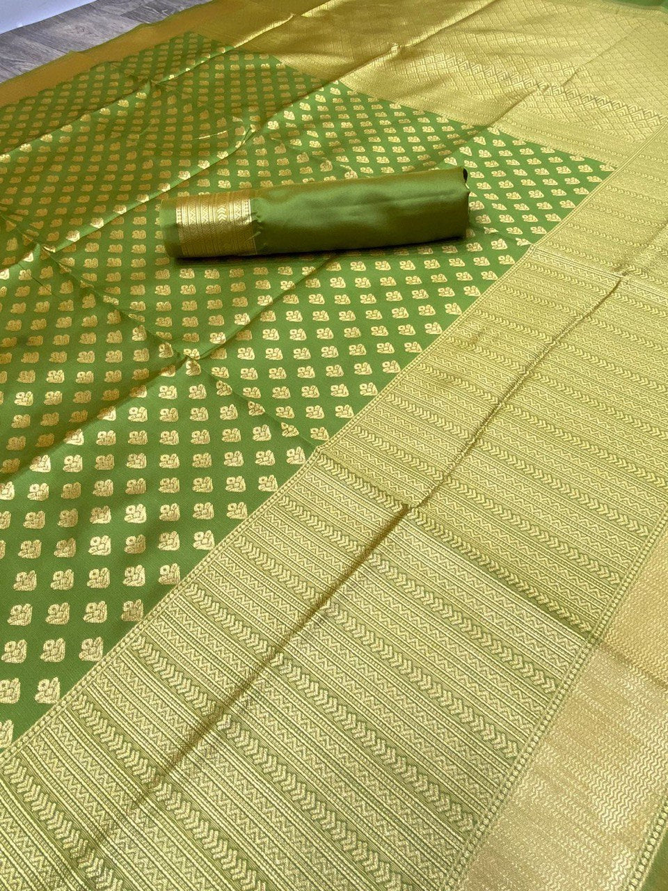 Bottle Green Silk Saree With Zari Weaving Work.