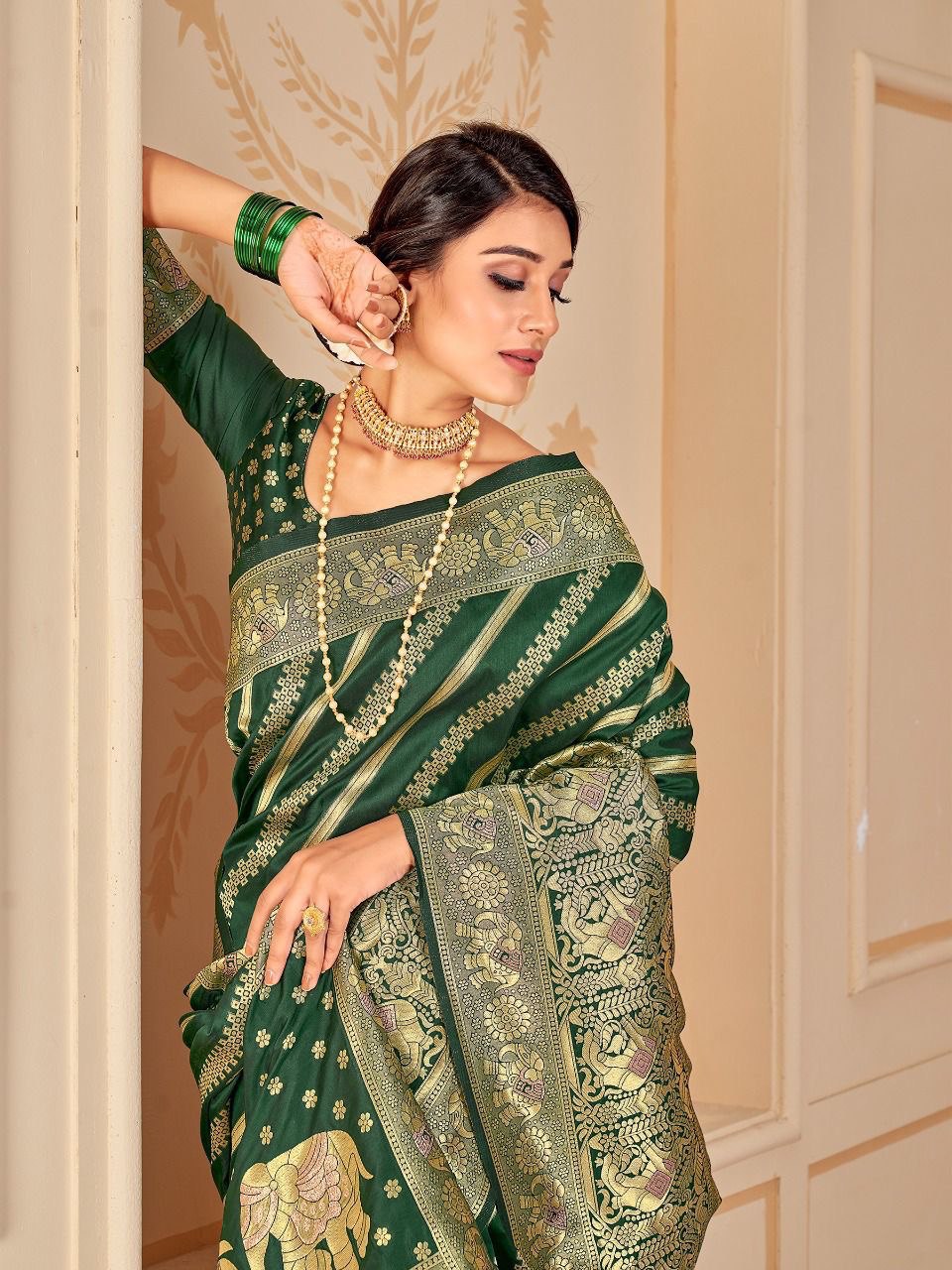 Bottle Green Silk Saree With Zari Weaving Work.