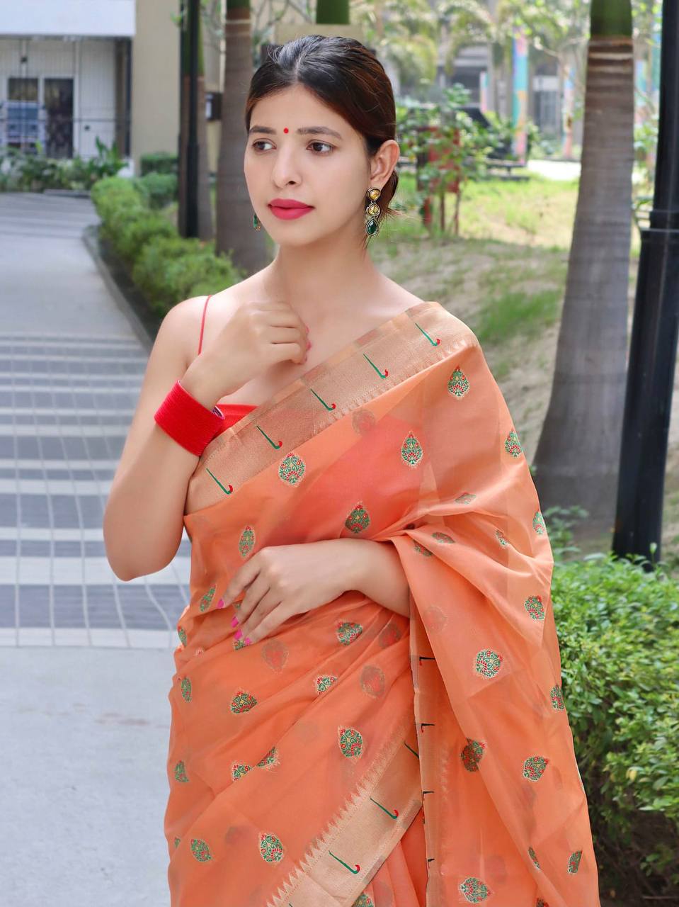 Orange Paithani Saree With Zari Weaving Border.